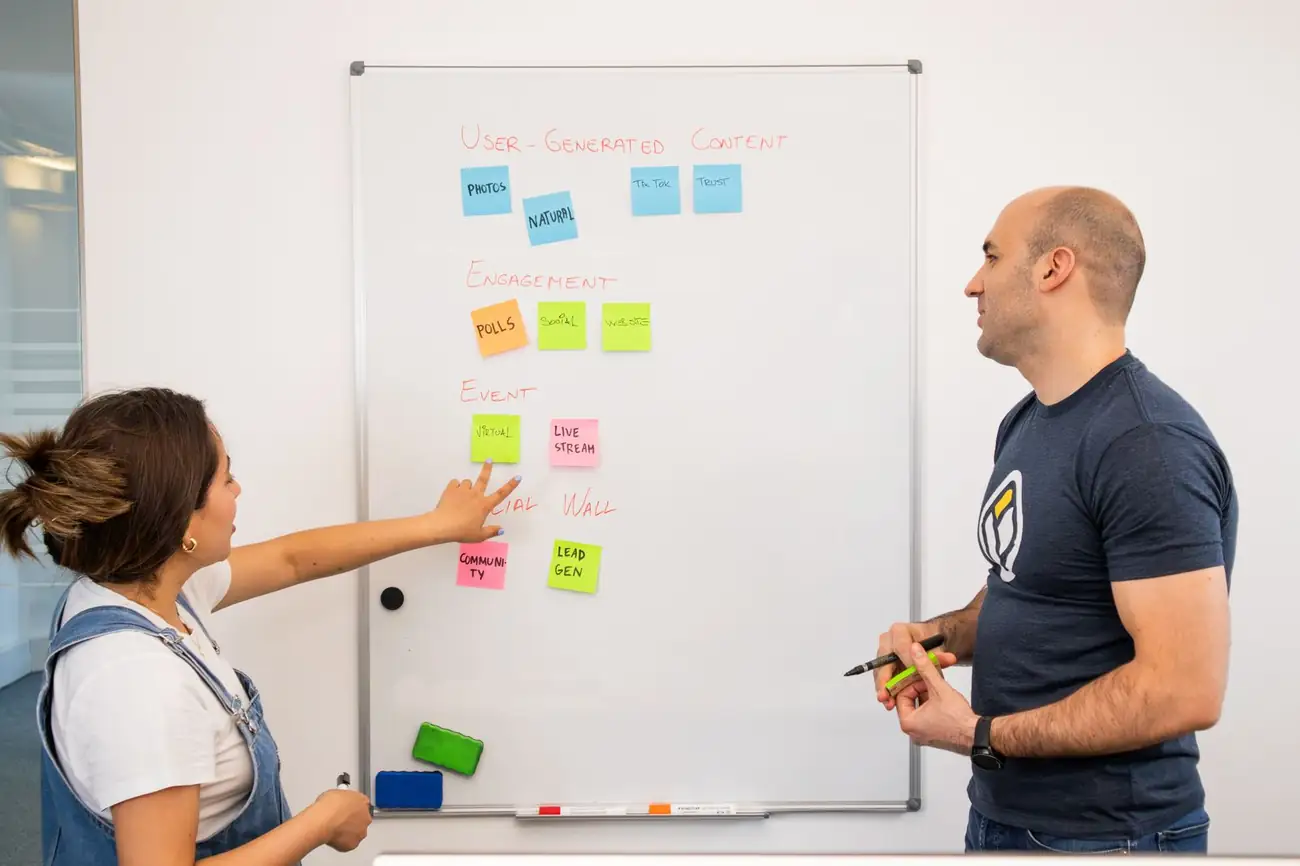 Colleagues planning at a whiteboard