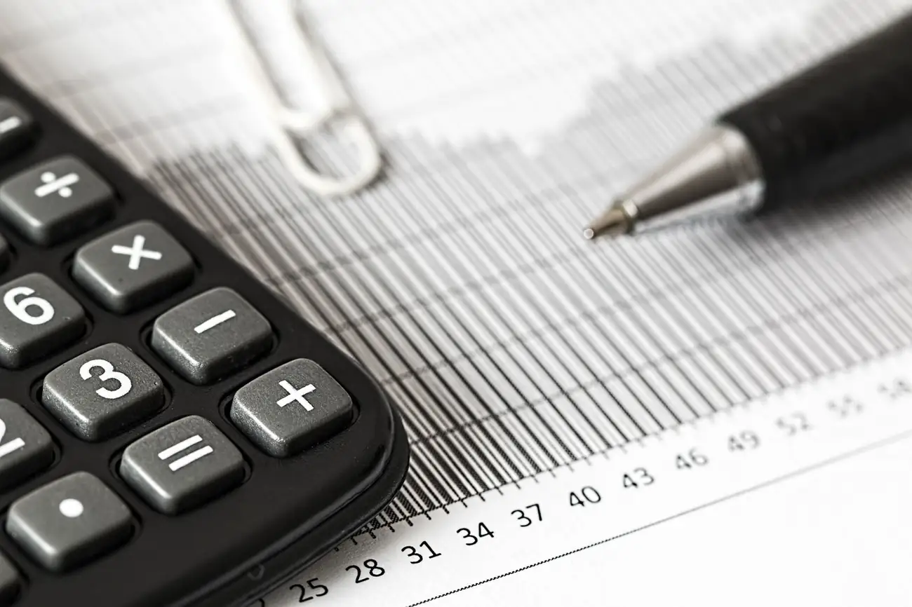 Calculator and pen on a printed chart