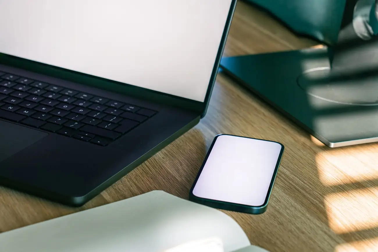 Modern workspace with laptop and smartphone