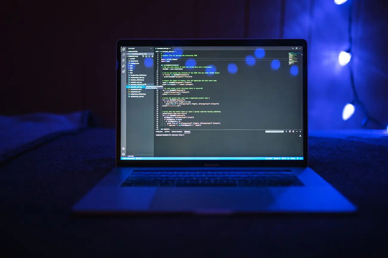 Laptop showing code in blue light